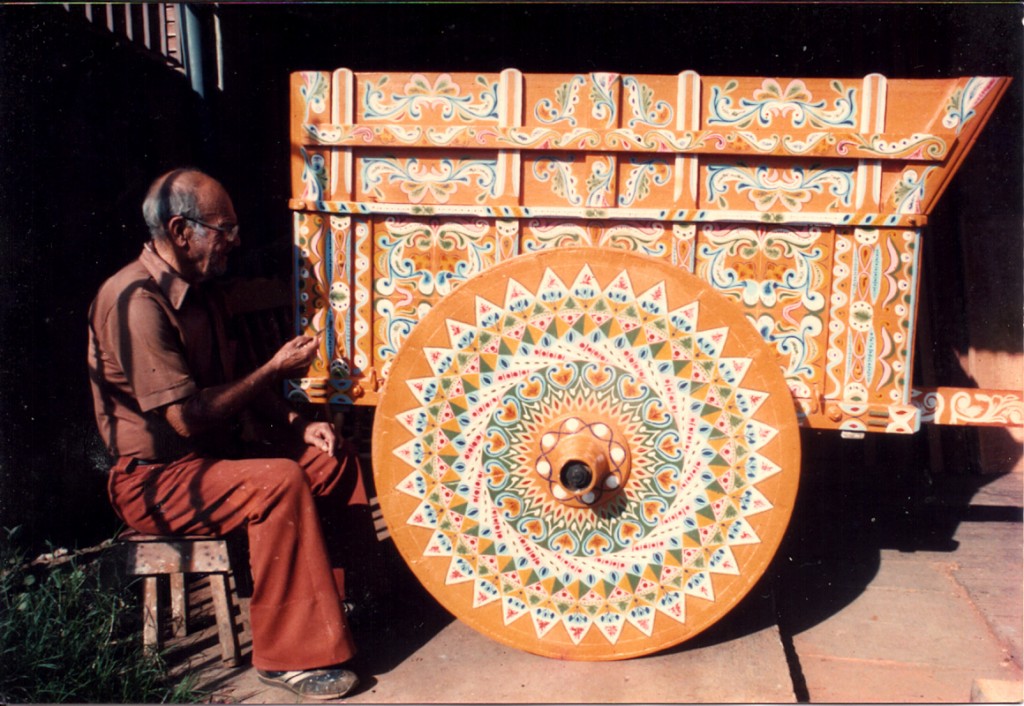 Abuelo Ramon putting the final touches on an oxcart circa 1980.